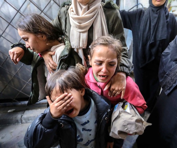 Children mourn victims of an air strike