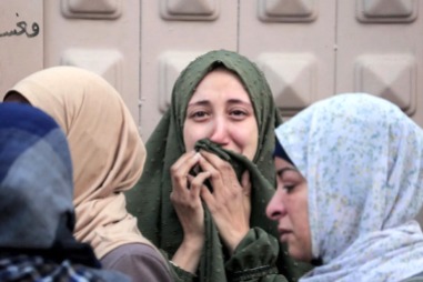 Palestinians react at al-Aqsa hospital in Deir el-Balah as people mourn the death of loved ones killed during Israeli bombardment, in the central Gaza Strip, on March 6, 2024.Credit- AFP